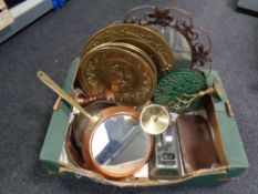 A box containing assorted metal ware to include brass plaques, vintage iron, trivets,