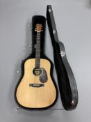 A Martin & Co DX1KAE spruce top six string electro acoustic guitar, with hard carry case.