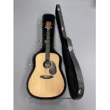 A Martin & Co DX1KAE spruce top six string electro acoustic guitar, with hard carry case.