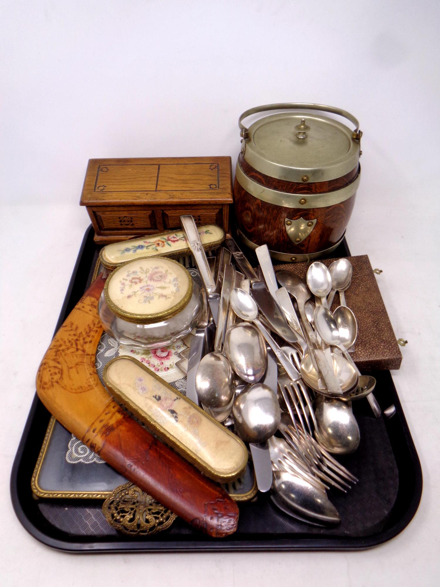 A tray containing Edwardian oak and plated biscuit barrel,