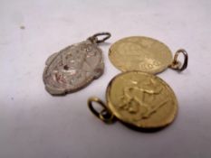 Three gold plated commemorative pendants