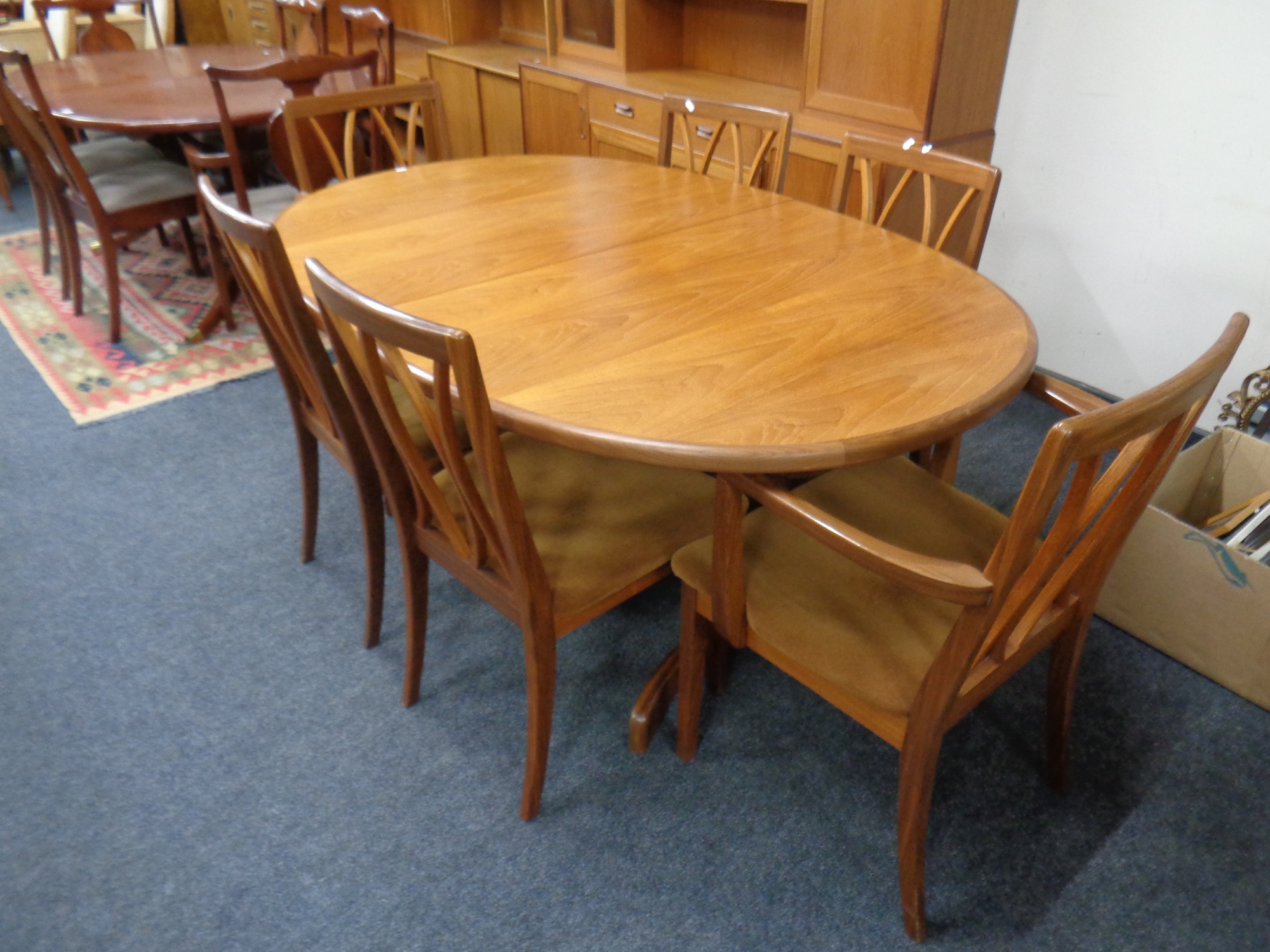 A mid 20th century teak G Plan oval extending dining table, 162 cm not including leaf,