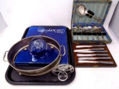 A tray containing assorted metal wares to include cased cutlery,