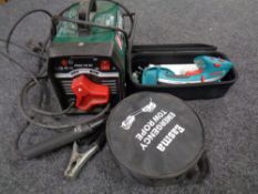 A box containing Bosch hand held lawn edger, Parkside PESG 120 B3 jump starter,