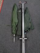 A Badger Eco carp rod stand together with a further rod stand and two fishing parasols