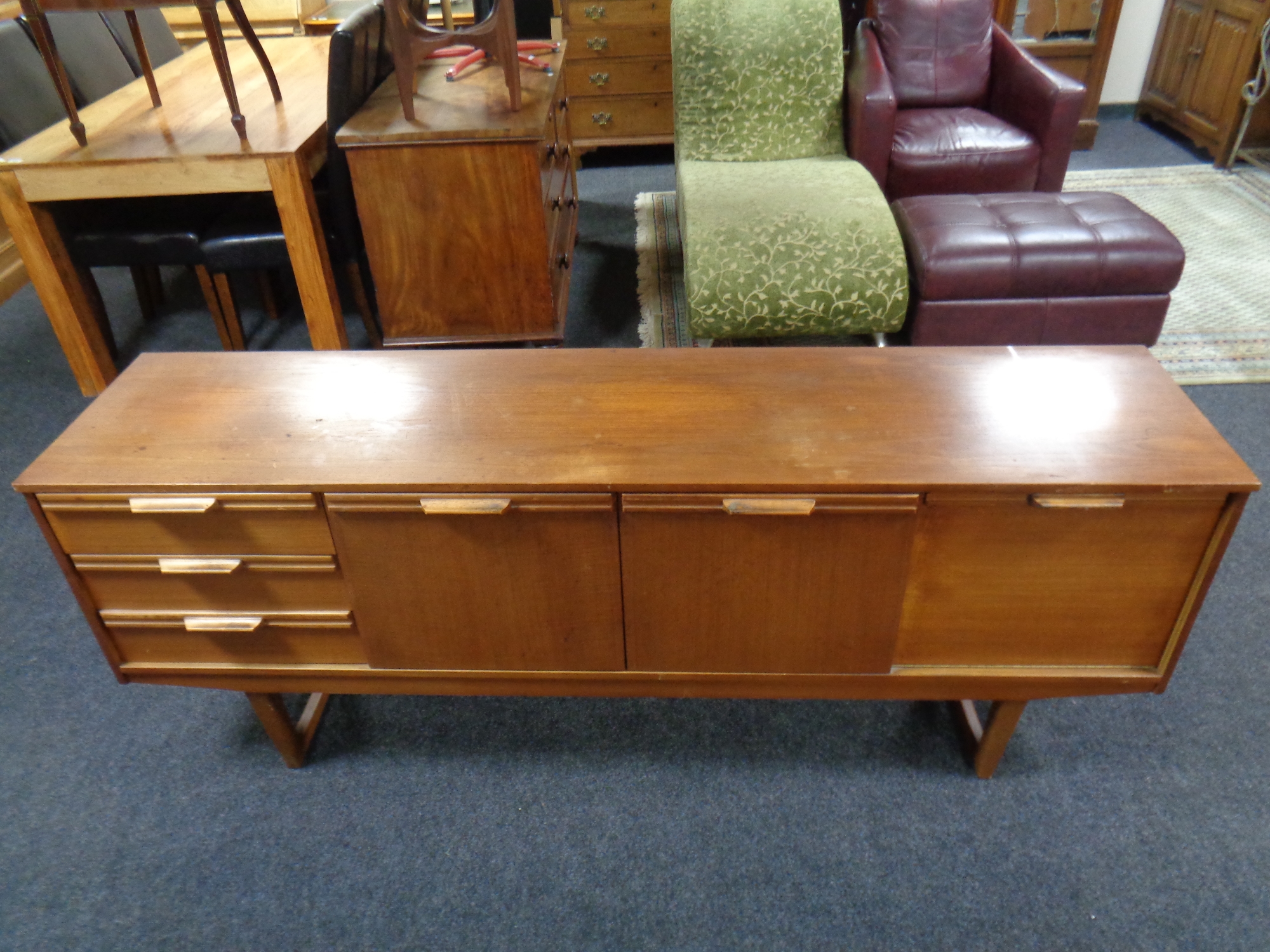 A mid 20th century teak low cocktail sideboard fitted cupboards and drawers,