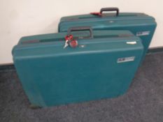 Two vintage Delsey hard shell luggage cases with keys