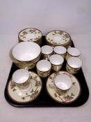 A tray containing an antique 30 piece Burslem hand painted tea service