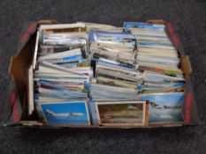A box containing a large quantity of aviation and American postcards