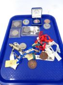 A box containing running medals, military whistle,