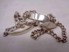 Three silver identity bracelets