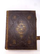 A 19th century leather bound Browns self interpreting family bible with colour lithographic book