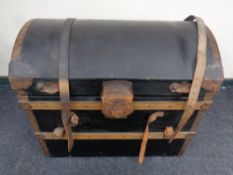 A late 19th century metal and wooden bound dome topped shipping trunk with lift out tray containing