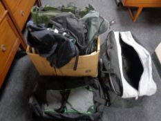 A box containing assorted holdall's and rucksacks