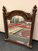 A contemporary bevelled mirror with pillared sides, width 104 cm,