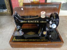 A 20th century Singer sewing machine in case (electrified)