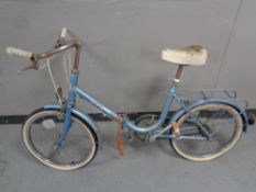 A vintage Super Scoot folding lady's bike