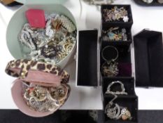 Three jewellery boxes containing a large quantity of assorted costume jewellery to include earrings,