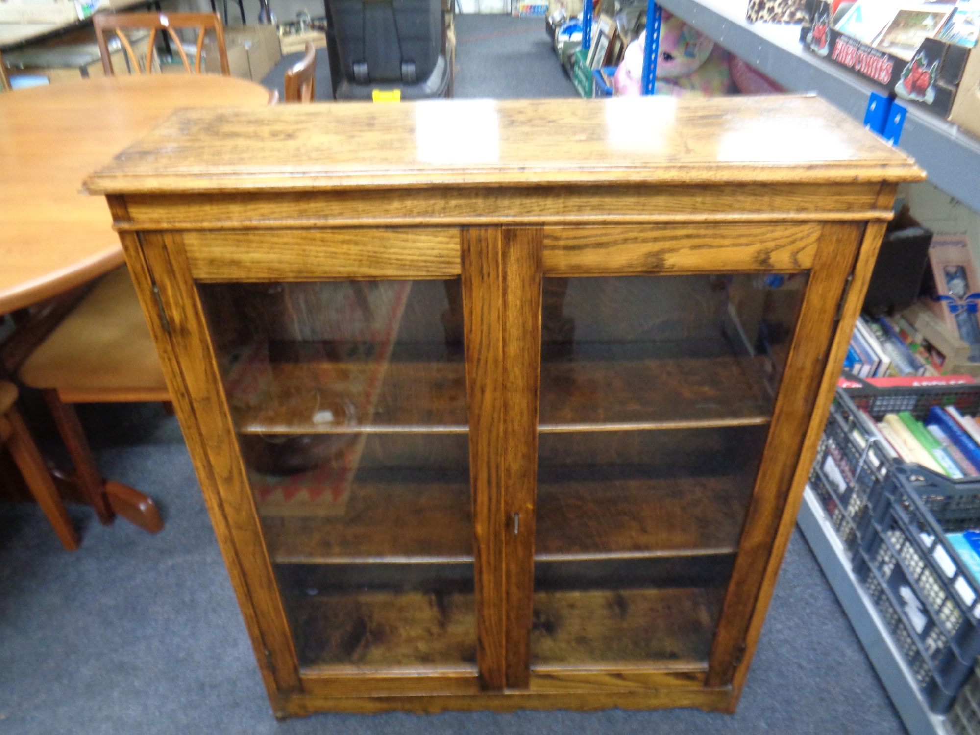 A 20th century oak double door glazed bookcase,