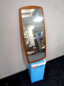 A mid 20th century frameless mirror mounted on a teak board together with a juice extractor,