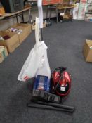 A Bissell quick wash carpet cleaner together with a Dynamo steam cleaner with accessories