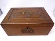A Victorian carved oak writing box