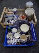 Two crates containing assorted ceramics to include Ringtons tea caddies, teapots, vases, planters,