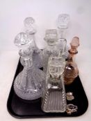 A tray containing six assorted cut glass and lead crystal decanters