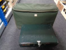 A Nash stove carry bag containing a Coleman duel fuel camp stove
