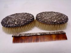 Two silver backed brushes and a silver mounted comb