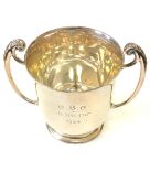 A silver twin handled trophy cup engraved 'CBC Beith Cup 1934' CONDITION REPORT: