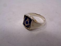 A silver masonic ring with swivel head