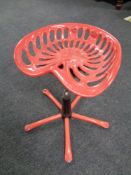 A Verite cast iron tractor seat stool