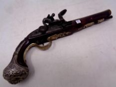 A replica flintlock pistol