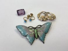 A silver and enamel butterfly brooch, together with a pair of gold and turquoise earrings,