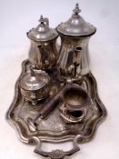 A four piece silver plated tea service on twin handled tray together with a plated bud vase