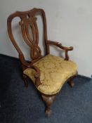 A 19th century Queen Anne style armchair