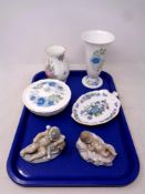 A tray containing assorted ceramics to include two Nao figures, baby and cherub,