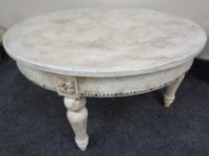 A shabby chic style circular coffee table