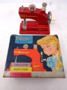A mid 20th century Vulcan Minor child's sewing machine in original box