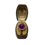 An 18ct yellow gold cabochon asterism ruby and diamond ring, 5.6g, size O.