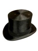 A vintage black top hat by Leonard's Hat Makers, internally measured 15.5 cm x 19.