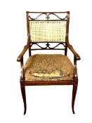 A late Victorian inlaid mahogany salon armchair with cane back and seat by James Shoolbred & Co,