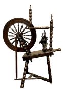 A nineteenth century elm and stained beech spinning wheel, height 102 cm.