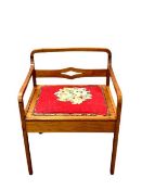 An early twentieth century tapestry seated music chair, width 58 cm.