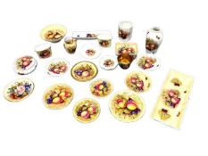 A collection of Aynsley bone china, decorated with panels of fruit and flowers.