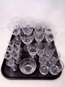 A tray of assorted lead crystal drinking glasses to include Edinburgh Crystal liqueur glasses