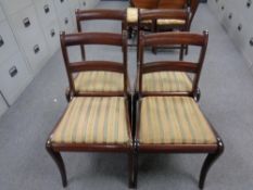 A set of four twentieth century mahogany dining chairs upholstered in Regency stripe fabric
