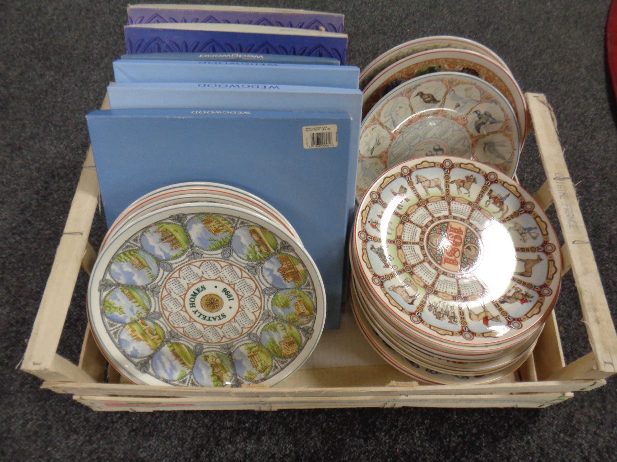 A box of Wedgwood calendar plates