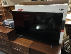 A JVC LT-40C 700 40 inch LED smart TV with remote and box,